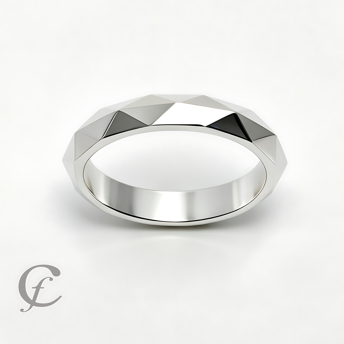 A silver faceted geometric band ring with a polished finish, displayed on a clean white background with a subtle shadow.