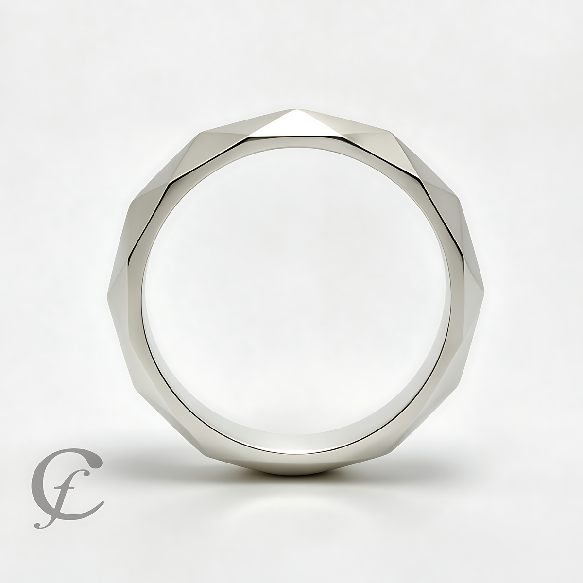 A silver-toned faceted ring with a geometric, multi-sided profile, photographed on a clean white background with a soft shadow.