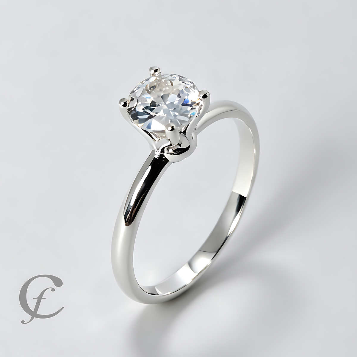 A silver solitaire engagement ring with a cushion-cut clear gemstone in a four-prong setting, shown on a light gray background with a subtle shadow.