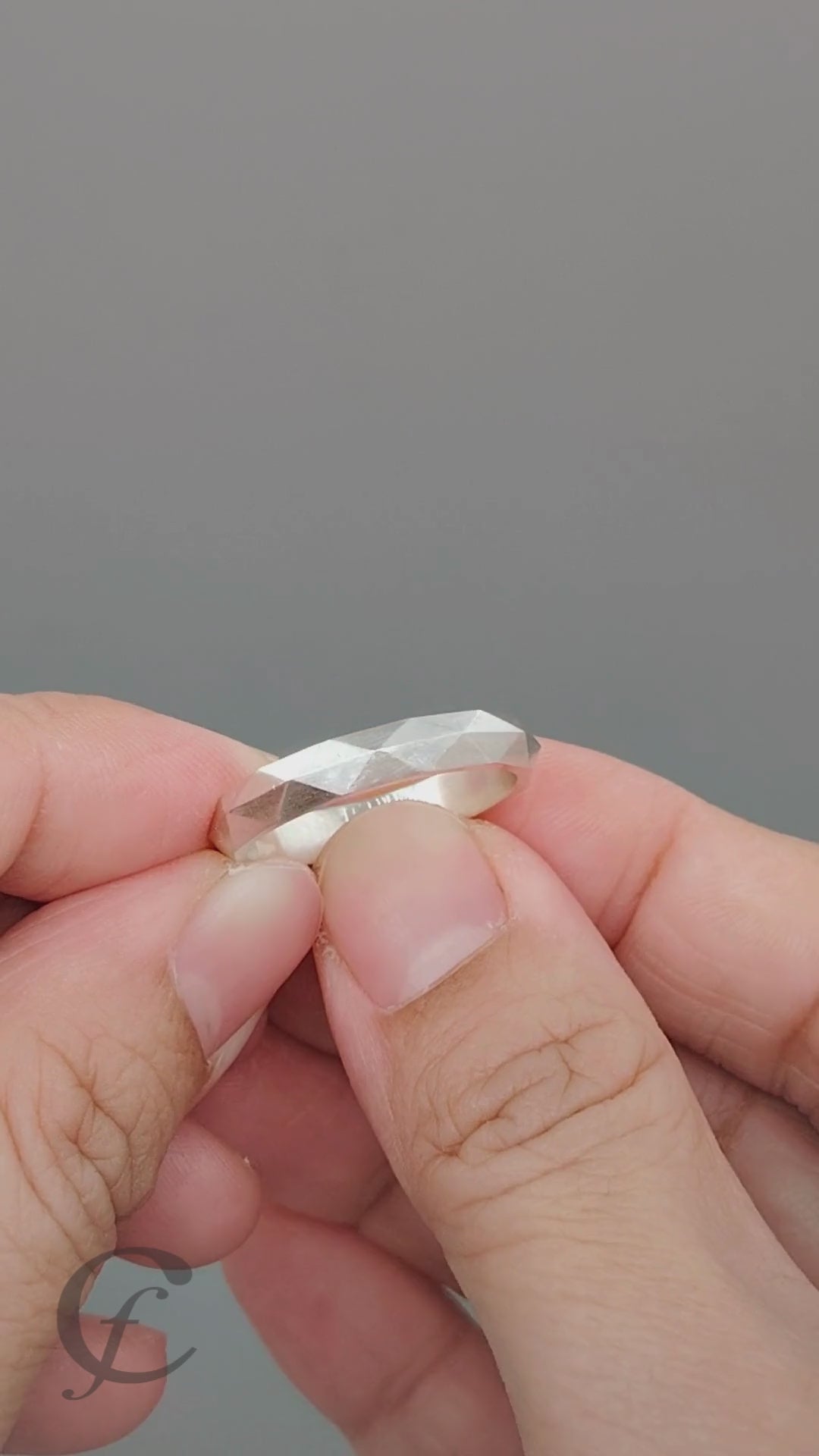Modern faceted wedding band handcrafted from solid 925 sterling silver with a satin finish. Features a minimalist geometric design, optional engraving, multiple sizes, and no plating or coating for authentic sterling silver beauty.